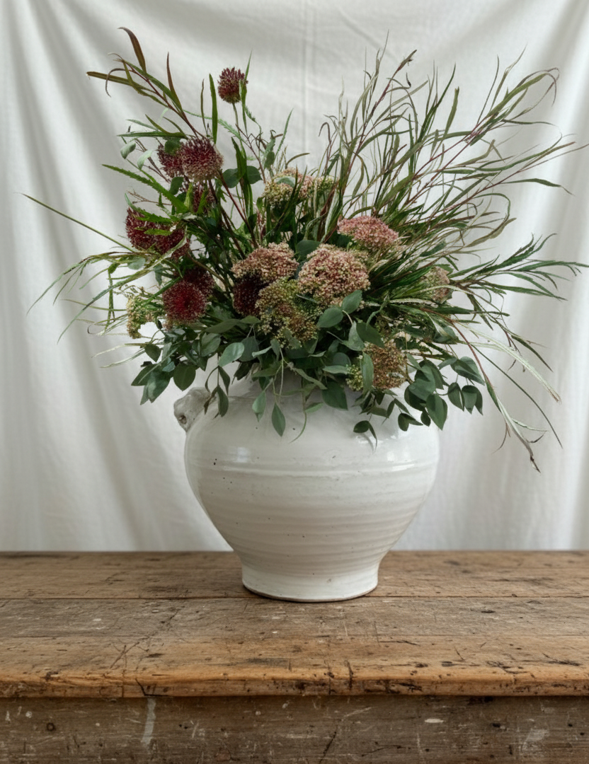 Rustikk krukke med løvehoder